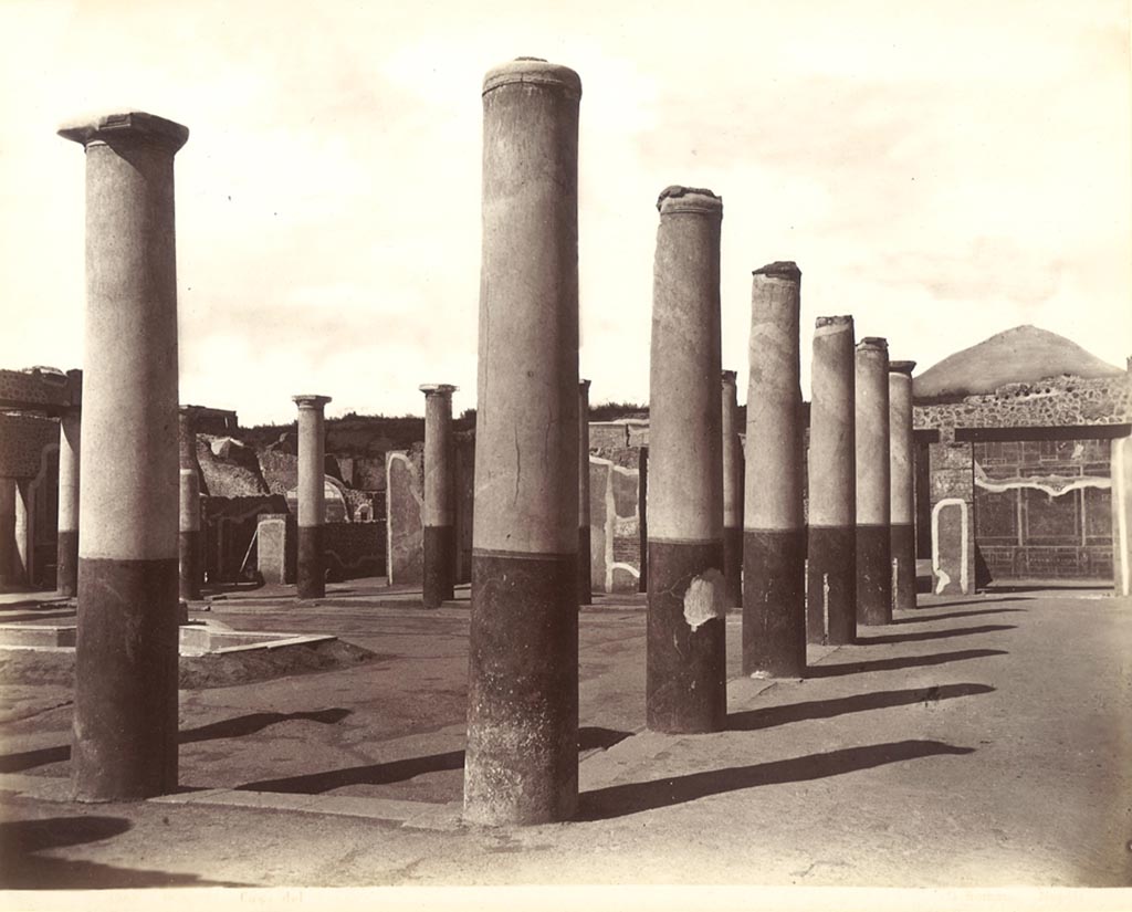 IX.8.6 Pompeii. c.1890s? G. Sommer no. 1254, wrongly identified as Casa del Fauno.
Looking north-west across the peristyle from outside room 12, the east portico is on the right. 
Photo courtesy of Rick Bauer.