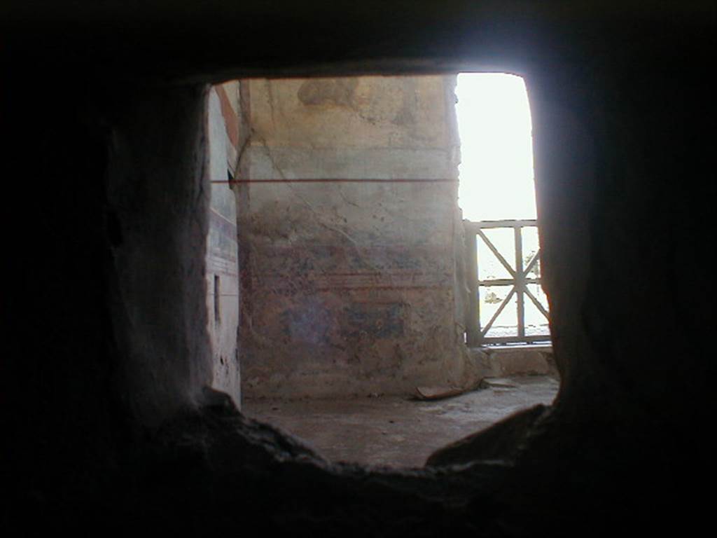 IX.8.6 Pompeii.  September 2004.  Room 18, Looking into Nymphaeum through duct in service corridor.