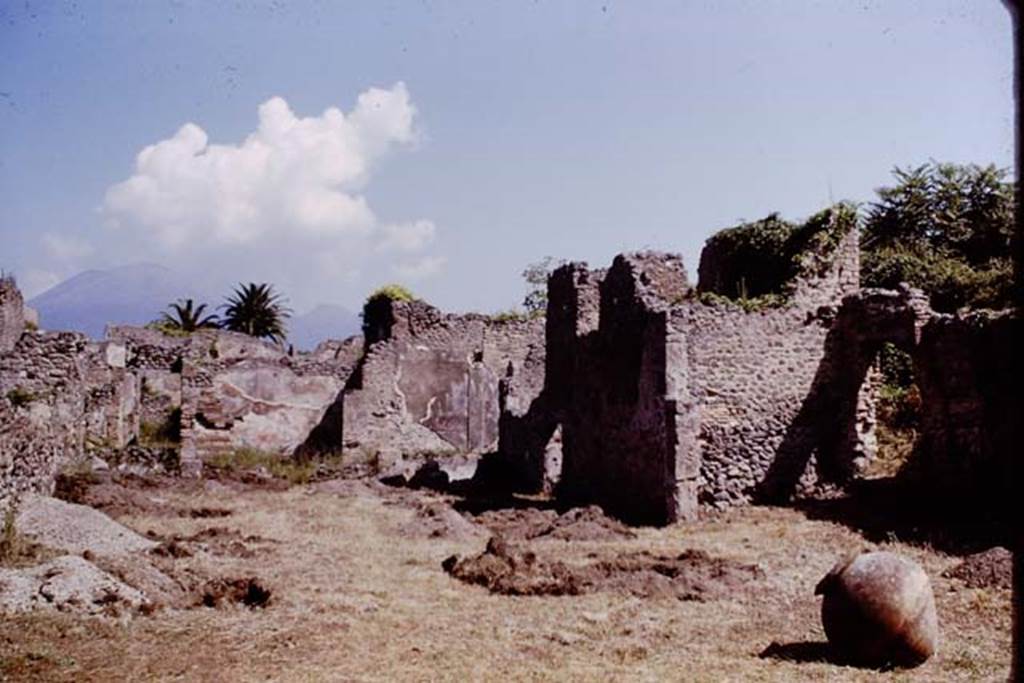 IX.9.6/10 Pompeii. 1964. Looking north across garden and the soil excavations. According to Wilhelmina, in this season they started with a trench towards the front of the garden.
Eventually they opened six trenches, each about the same size as they had put in the previous time, but without excavating the entire width of garden. They felt it was unnecessary to excavate the entire garden, as they soon found roots in the trenches, which they marked at regular intervals. These regular cavities made it obvious they had found a vineyard. Photo by Stanley A. Jashemski.
See Jashemski, W.F., 2014. Discovering the Gardens of Pompeii: Memoirs of a Garden Archaeologist. (p.121)
Source: The Wilhelmina and Stanley A. Jashemski archive in the University of Maryland Library, Special Collections (See collection page) and made available under the Creative Commons Attribution-Non Commercial License v.4. See Licence and use details.
J64f1269