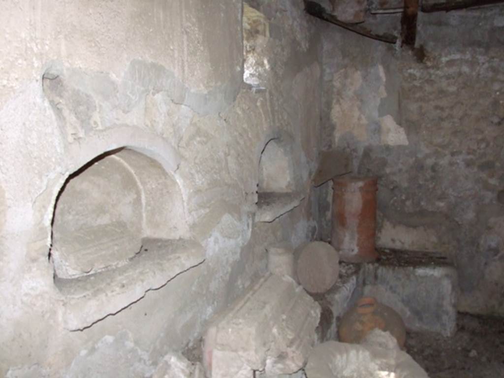 IX.9.10 Pompeii.  March 2009.   North wall, with two arched Niches.