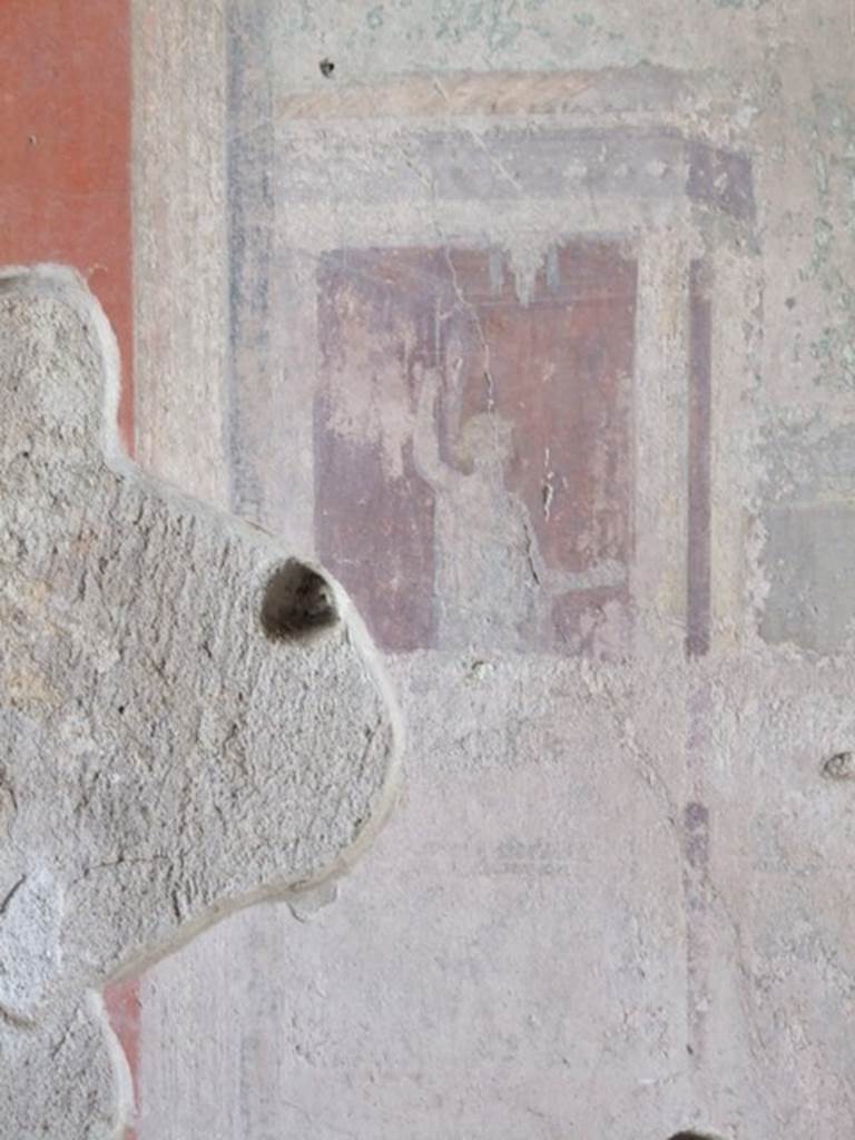 IX.9.c Pompeii. March 2009. Architectural painting with a figure, from east end of central panel on south wall of triclinium.