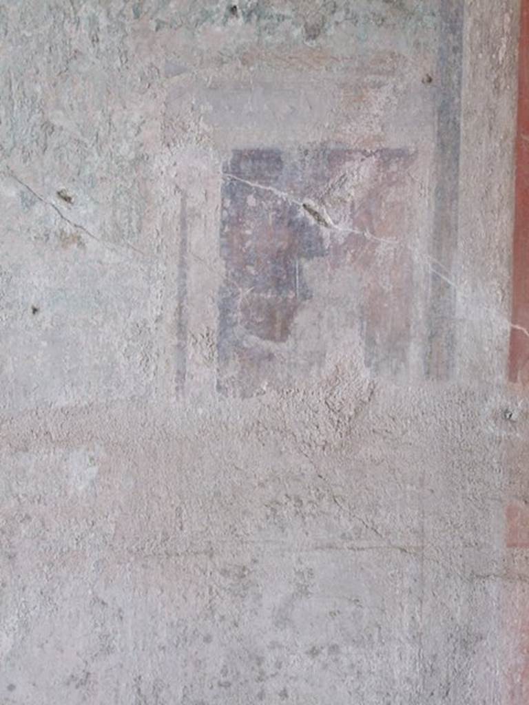 IX.9.c Pompeii. March 2009. Architectural painting with a figure, from west end of central panel on south wall of triclinium.