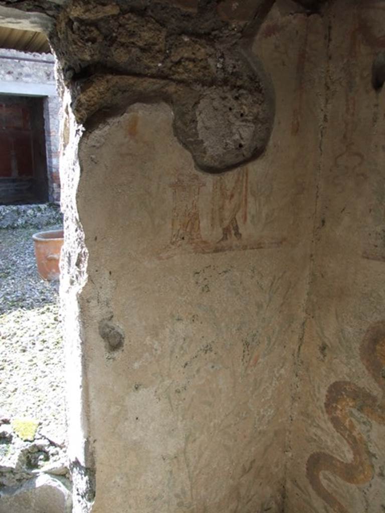 IX.9.c Pompeii. March 2009. North-west corner of kitchen, with painted lararium.