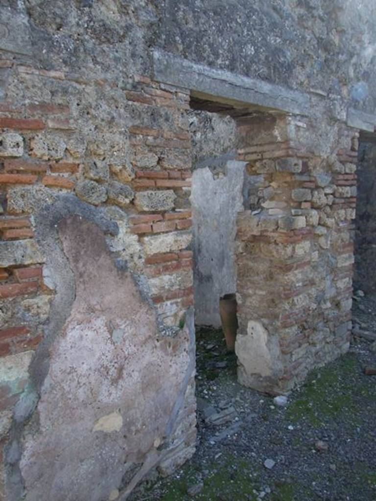 IX.9.d Pompeii. March 2009. Doorway to room g, cubiculum.
According to NdS, this cubiculum would have had Opus signinum flooring and walls with white background.
On the atrium wall pilaster dividing the doorways to rooms g and h, on the right, a graffito was found, it read  –
CTXXXV
PLXXXVII
See Notizie degli Scavi, 1889, p.131.