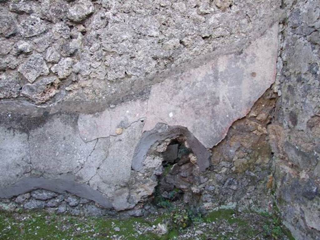 IX.9.d Pompeii. March 2009. Room k, remaining plaster above bench on south wall of kitchen.  According to Schefold, a sacred landscape was found painted on this wall.
See Schefold, K., 1962. Vergessenes Pompeji. Bern: Francke. (p. 153f. and Taf. 152,3. 153,1)