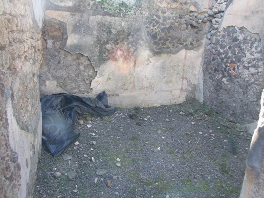IX.9.d Pompeii. March 2009. Room c, west wall of cubiculum.  According to NdS, the floor of the cubiculum was of signinum, and the walls were painted on a white background. In the panels on the walls, framed by red bands, were painted cupids. One held a dove or pigeon, another a rabbit, and the third pushing forward a piglet. In the south wall was the bed recess, and in the west wall there was a window at the top.
See Notizie degli Scavi, 1889, p.130