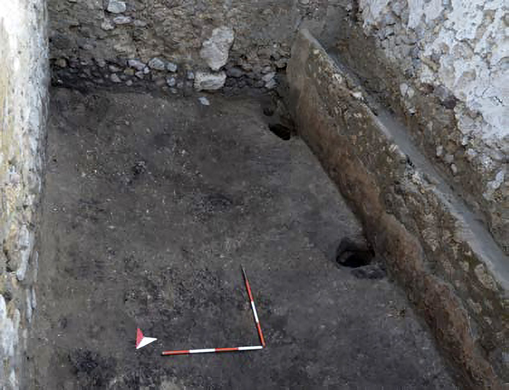 IX.10.1 Pompeii.  December 2023. Room 9.
Stable room 9 is a rectangular-shaped space characterised along the western side by a masonry structure with a trough used as a manger. 
The plain earthen floor in the area facing the manger revealed three post holes that must have supported a wooden structure, perhaps already disused at the time of the renovation site.
Photograph © Parco Archeologico di Pompei.
See Pompeii E-Journal 08, 08.12.2023, p. 88, fig. 5. Download: PAP e-journals 2023 collection volumes 01-09