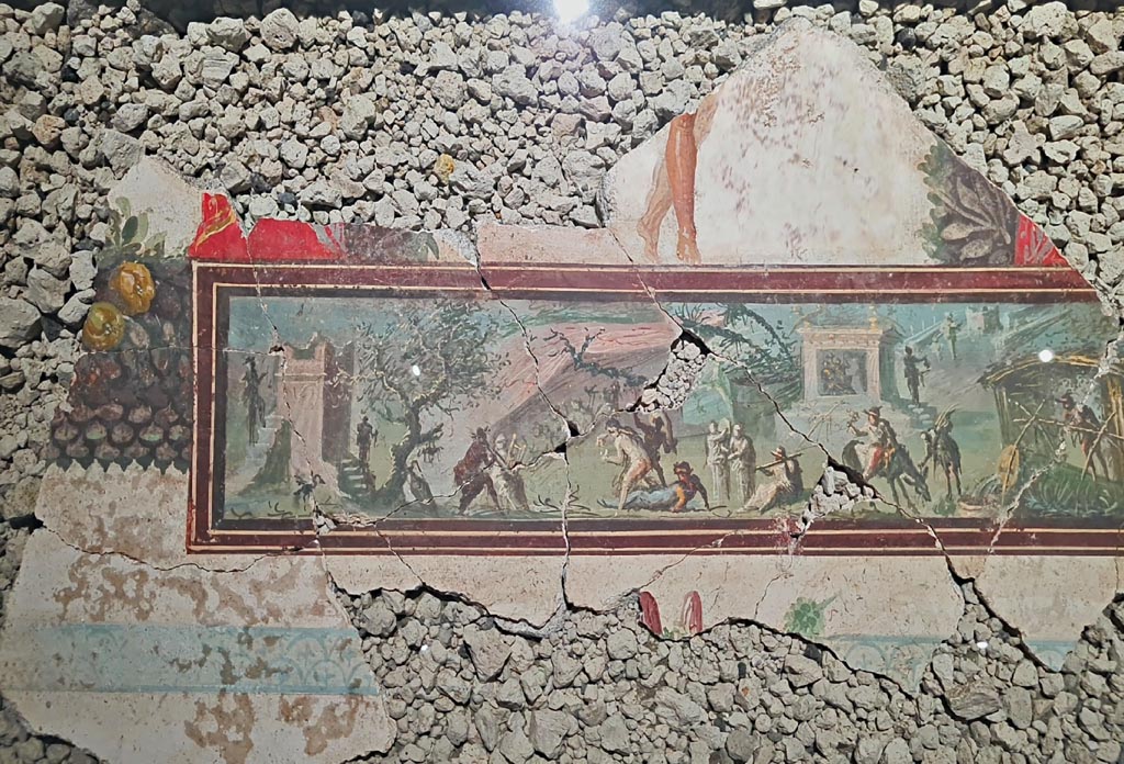 IX.10.1 Pompeii. March 2024. 
Detail of fragment of ceiling with painting showing a wayfarer in a Nilotic scene, on display in an exhibition entitled –
“L’altra Pompei, vite comuni all’ombra del Vesuvio”. Photo courtesy of Giuseppe Ciaramella.