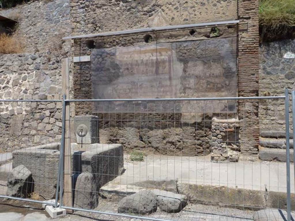 IX.11.1 Pompeii. June 2012. Photo courtesy of Michael Binns. North side of Via dell’Abbondanza, on the extreme left is the unexcavated roadway between IX.7 and IX.11.
On the extreme right is the entrance doorway to IX.11.1.