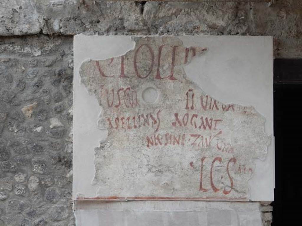 IX.11.2 Pompeii. May 2017. Graffiti on west side of entrance. Photo courtesy of Buzz Ferebee.