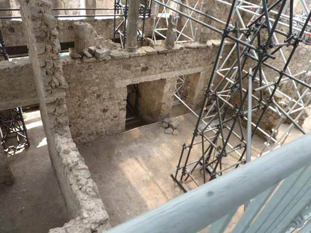 IX.12.5 Pompeii, rear room, (on left) and IX.12.4, atrium “c”, and doorway into IX.12.3, (centre and right). 
May 2010. Looking south-west from above.