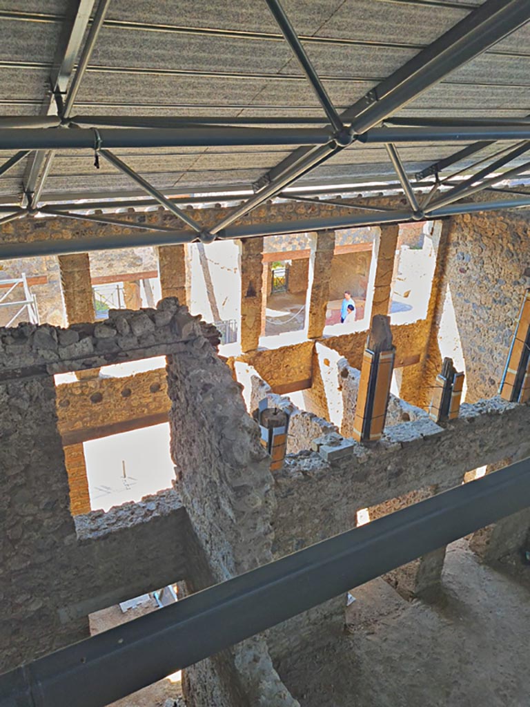 IX.12.5 Pompeii, on left. June 2024. 
Looking south, with entrance corridor/fauces “a” of IX.12.4, centre right. Photo courtesy of Giuseppe Ciaramella.
