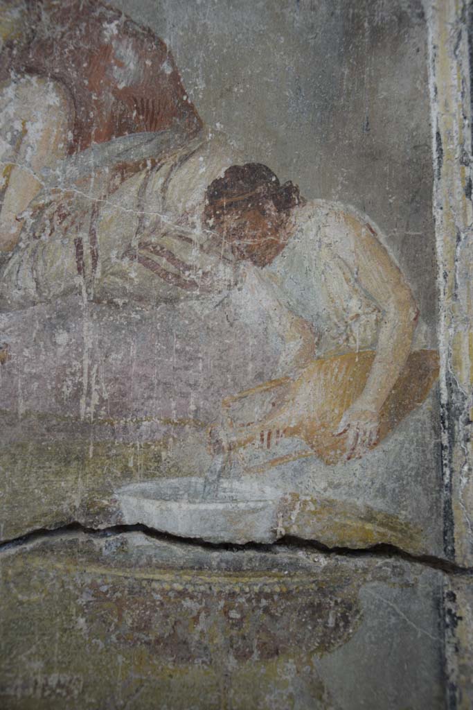 IX.12.6 Pompeii. February 2017. 
Room “m”, detail of figure pouring wine in banqueting scene on north wall.
Photo courtesy of Johannes Eber.
