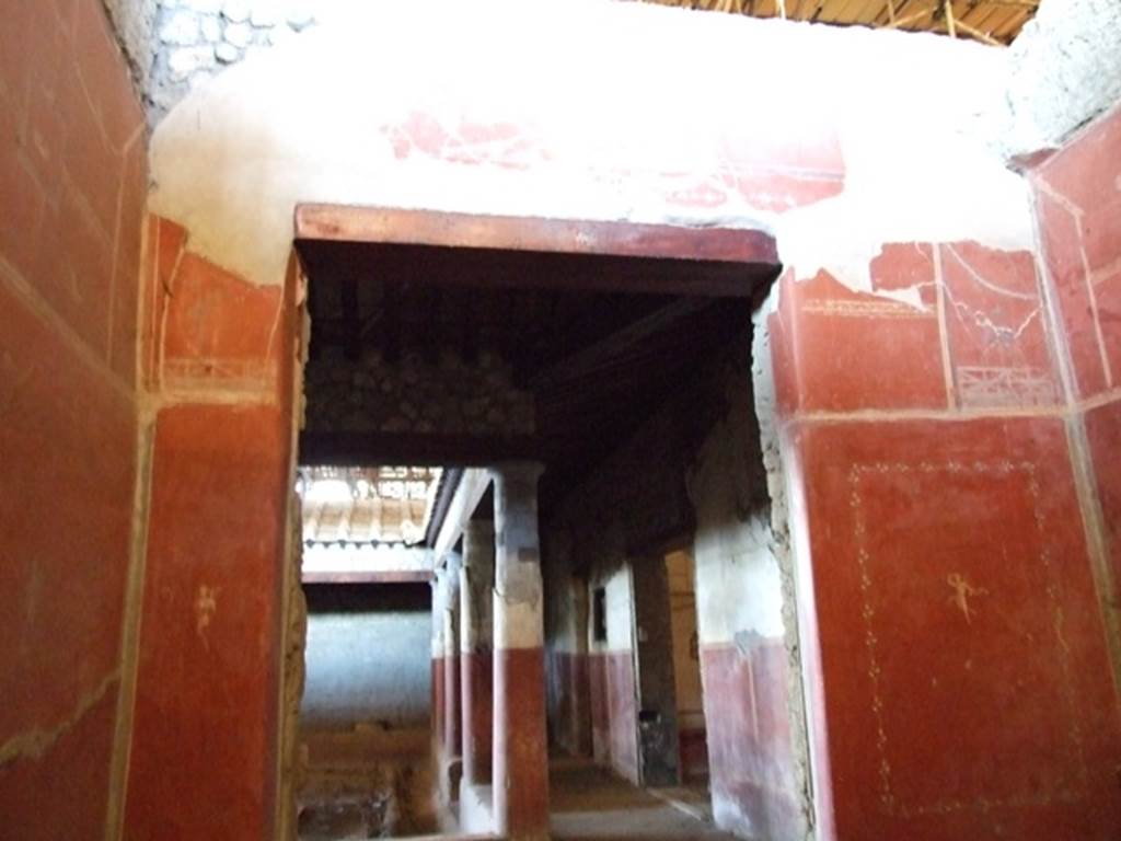 IX.12.9 Pompeii. March 2009. Room 3, west wall of cubiculum, with doorway looking west across north portico 5b. 
.
