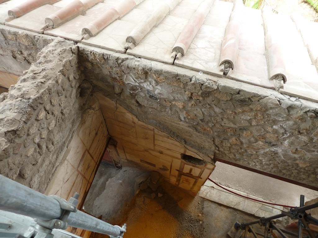 IX.12.9 Pompeii. May 2010. Room 13, south side. 
Doorway to room 11 in east wall, blocked by material, and doorway to garden area 5 in south wall.