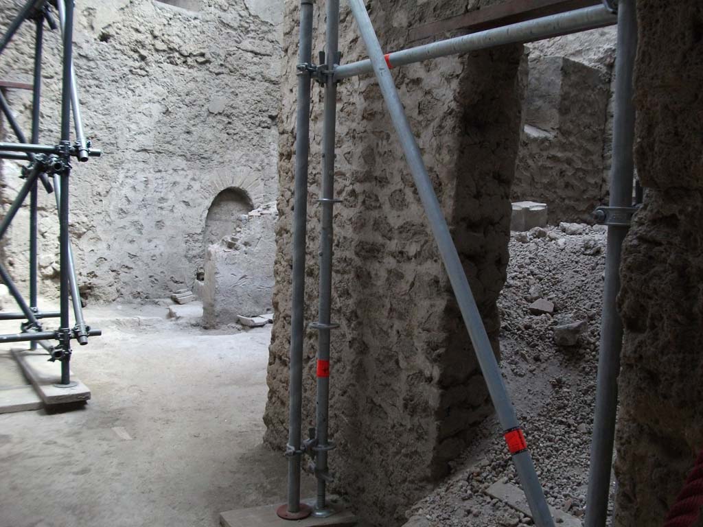 IX.12.9 Pompeii. May 2010. Looking east from portico 5c, into room 1, kitchen, and small room 2, unexcavated on right.