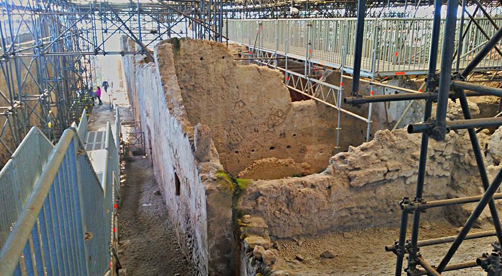IX.12.B/IX.12.9 Pompeii. 2016/2017. 
Looking south along roadway between IX.13 and IX.12 from excavated north-east corner of insula IX.12, with room “a”, on right. 
Photo courtesy of Giuseppe Ciaramella.
a.