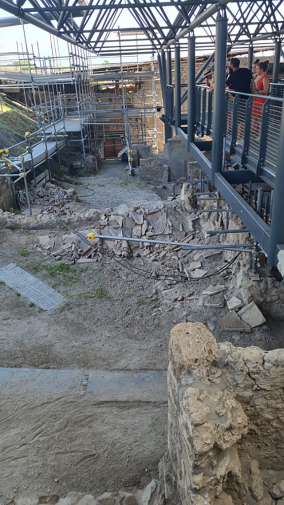 IX.12.B Pompeii. June 2024. 
Looking east along rear of insula from north-west corner. 
The collapsed roof is shown in the area of number 20/19 on the plan.
Photo courtesy of Giuseppe Ciaramella.
.
