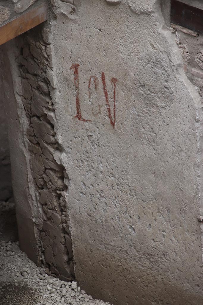 IX.12.B Pompeii. October 2024. 
Room 15, painted inscription on west wall on south side of window. Photo courtesy of Klaus Heese.