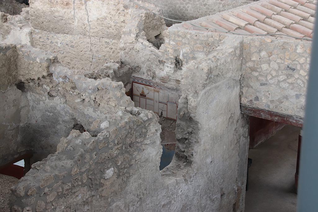 IX.12.B Pompeii. October 2024. 
Room 16, looking towards east wall, with room 6/7 on left, and doorway to west portico 5, of IX.12.A/IX.12.9, on right.
Photo courtesy of Klaus Heese.