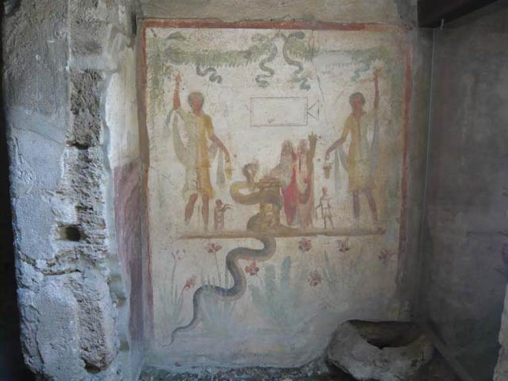 IX.13.1-3 Pompeii. May 2012. Room 21, lararium in south west corner, west wall of services atrium. Photo courtesy of Buzz Ferebee.
