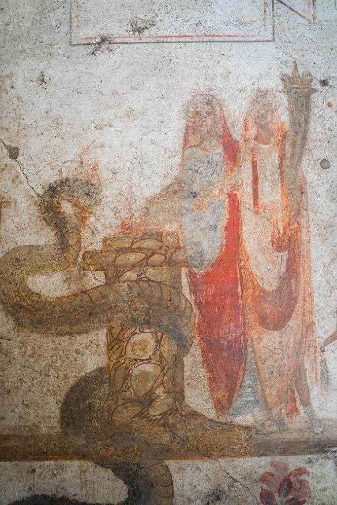 IX.13.1-3 Pompeii. October 2021. 
Room 21, detail from lararium. Photo courtesy of Johannes Eber.