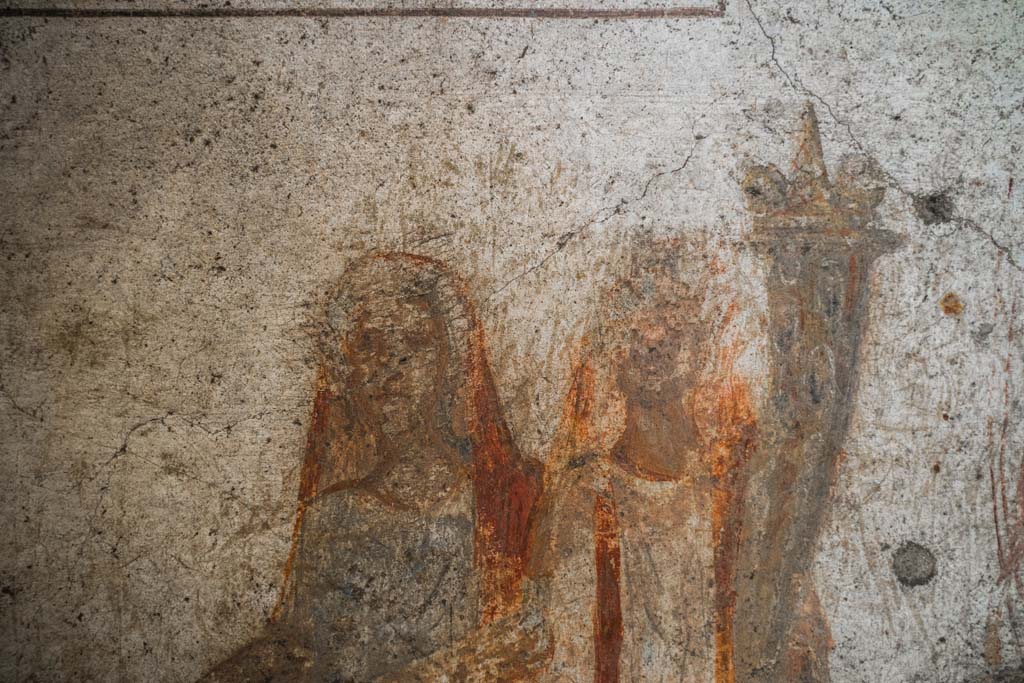 IX.13.1-3 Pompeii. October 2021. 
Room 21, detail from lararium. Photo courtesy of Johannes Eber.