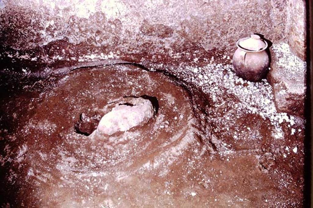 IX.13.1-3 Pompeii, 1973. “Sombrero” and pot at base of west wall. Photo by Stanley A. Jashemski. 
Source: The Wilhelmina and Stanley A. Jashemski archive in the University of Maryland Library, Special Collections (See collection page) and made available under the Creative Commons Attribution-Non Commercial License v.4. See Licence and use details. J73f0557