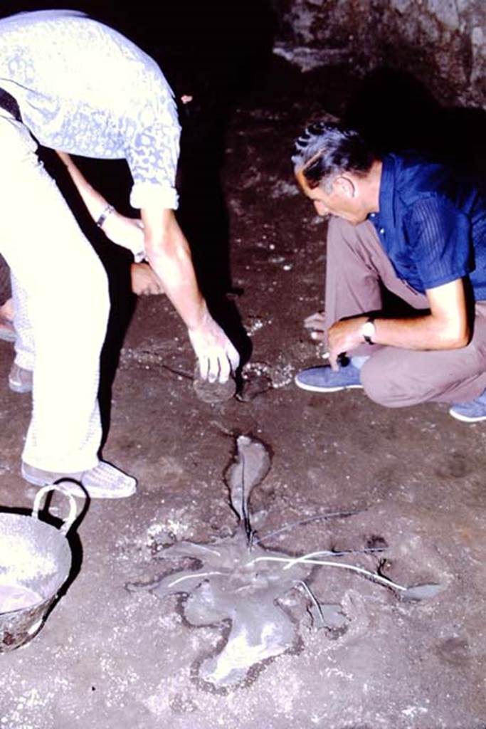 IX.13.1-3 Pompeii, 1973. Filling the cavity. Photo by Stanley A. Jashemski. 
Source: The Wilhelmina and Stanley A. Jashemski archive in the University of Maryland Library, Special Collections (See collection page) and made available under the Creative Commons Attribution-Non Commercial License v.4. See Licence and use details. J73f0532