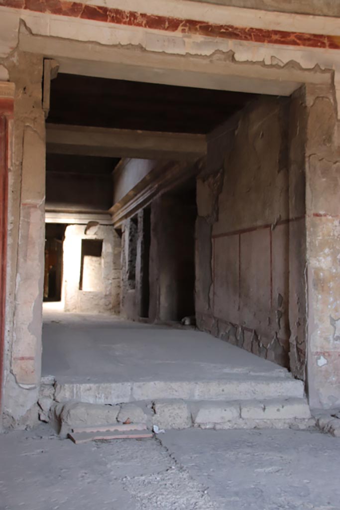 IX.13.1-3 Pompeii. October 2022. 
Room 1, looking north towards east wall of room 28. Photo courtesy of Klaus Heese.