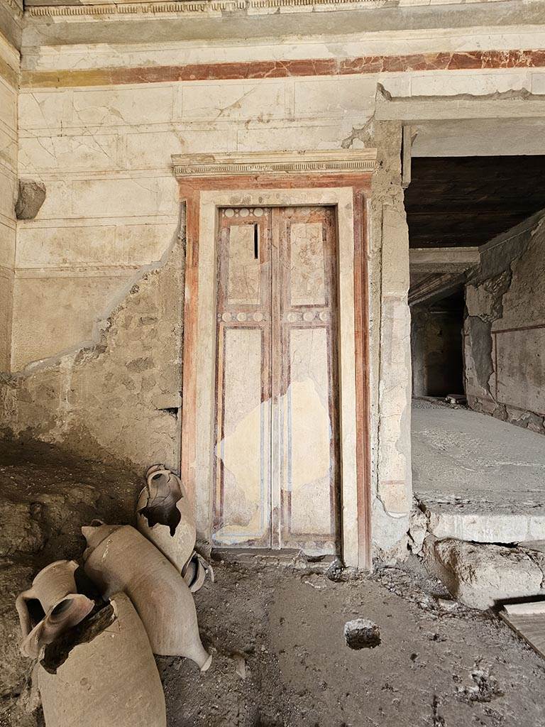 IX.13.3 Pompeii. November 2024. 
Room 1, painted doorway in north-west corner. Photo courtesy of Annette Haug.