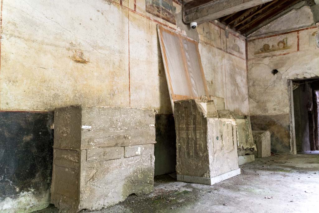 IX.13.3 Pompeii. October 2021. 
Room 9, plaster casts of cupboards or chests against east wall of portico in south-east corner. Photo courtesy of Johannes Eber.