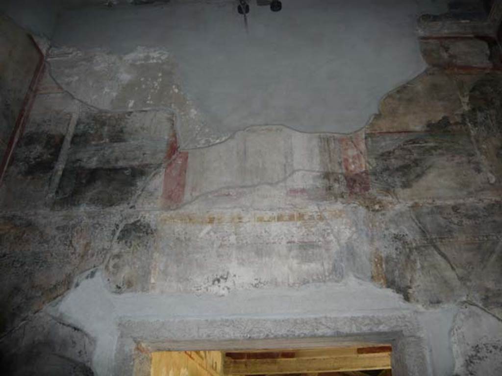 IX.13.1-3 Pompeii. May 2012.  Room 10, upper south wall above doorway to peristyle.
Photo courtesy of Buzz Ferebee.
