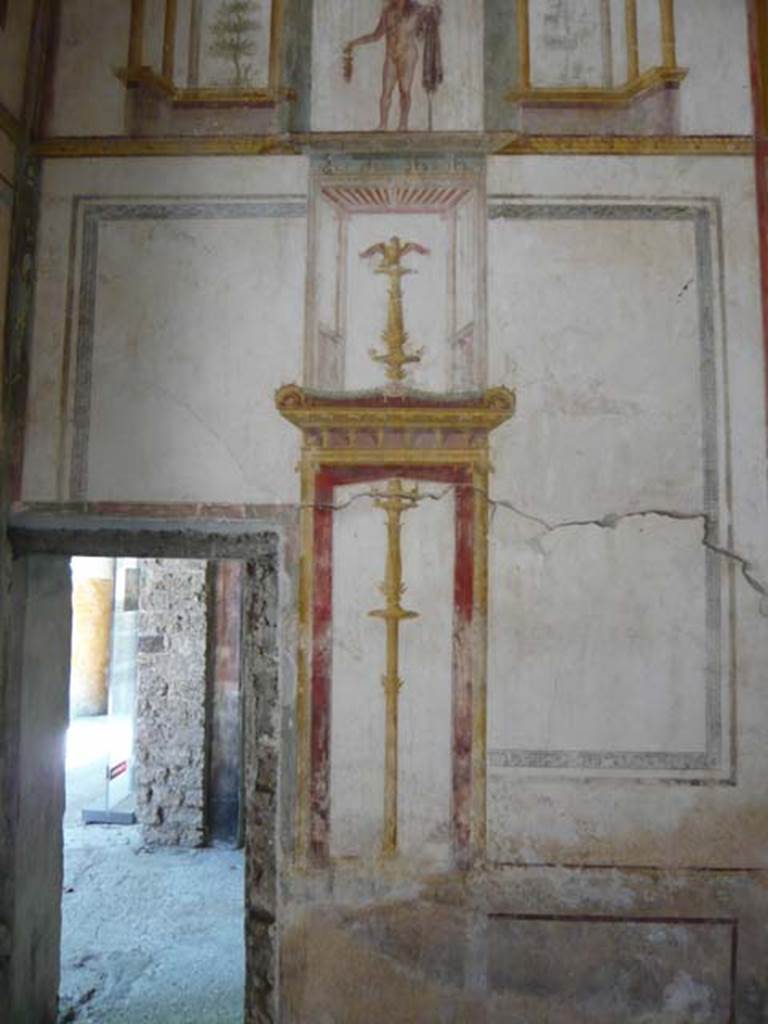 IX.13.1-3 Pompeii. May 2012. Room 11, detail from south end of west wall with doorway to antechamber of room 12. Photo courtesy of Buzz Ferebee.