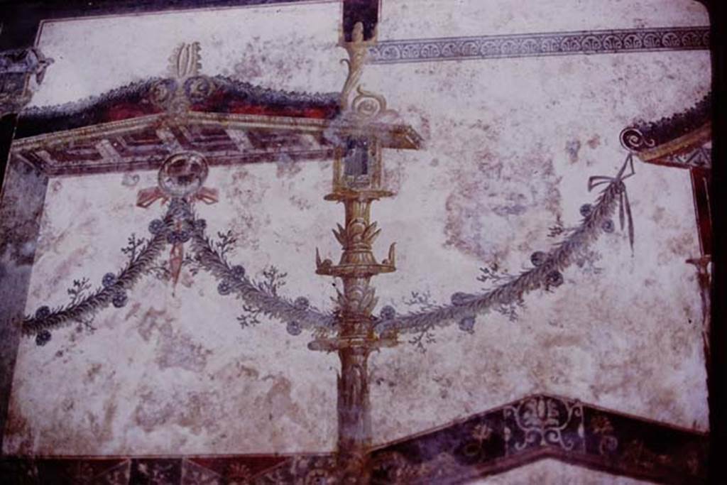 IX.13.1-3 Pompeii. 1975. Room 11, detail from east end of upper north wall. Photo by Stanley A. Jashemski.   
Source: The Wilhelmina and Stanley A. Jashemski archive in the University of Maryland Library, Special Collections (See collection page) and made available under the Creative Commons Attribution-Non Commercial License v.4. See Licence and use details. J75f0684