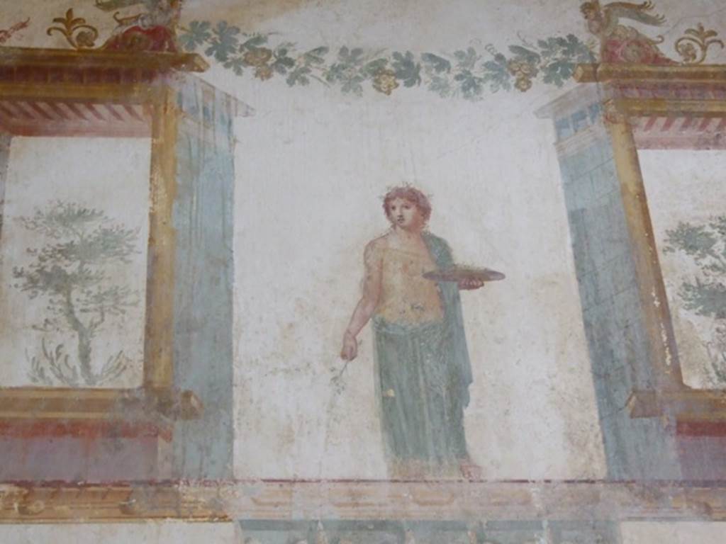 IX.13.1-3 Pompeii. March 2009. Room 11, east wall. Painted figure with plate.
