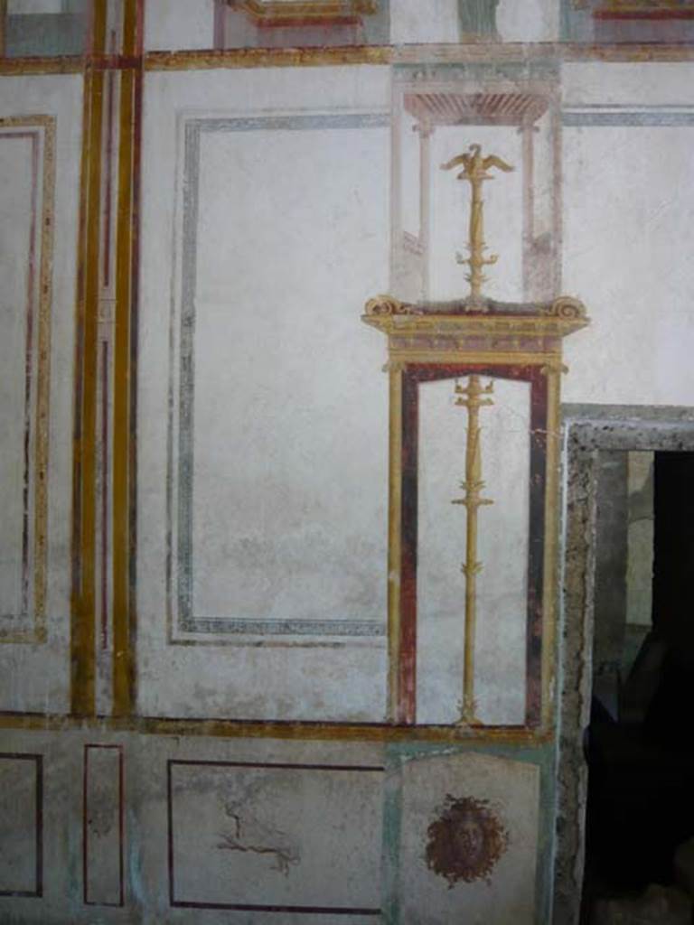 IX.13.1-3 Pompeii. May 2012.  Room 11, detail from south end of east wall, near doorway to room 10. Photo courtesy of Buzz Ferebee.