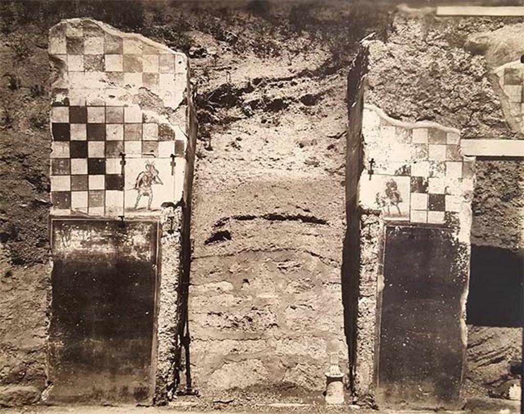 IX.13.5 Pompeii. 1915. Entrance with walls decorated with a checkerboard pattern and paintings of Romulus and Aeneas. 
Photograph courtesy of Parco Archeologico di Pompei.
