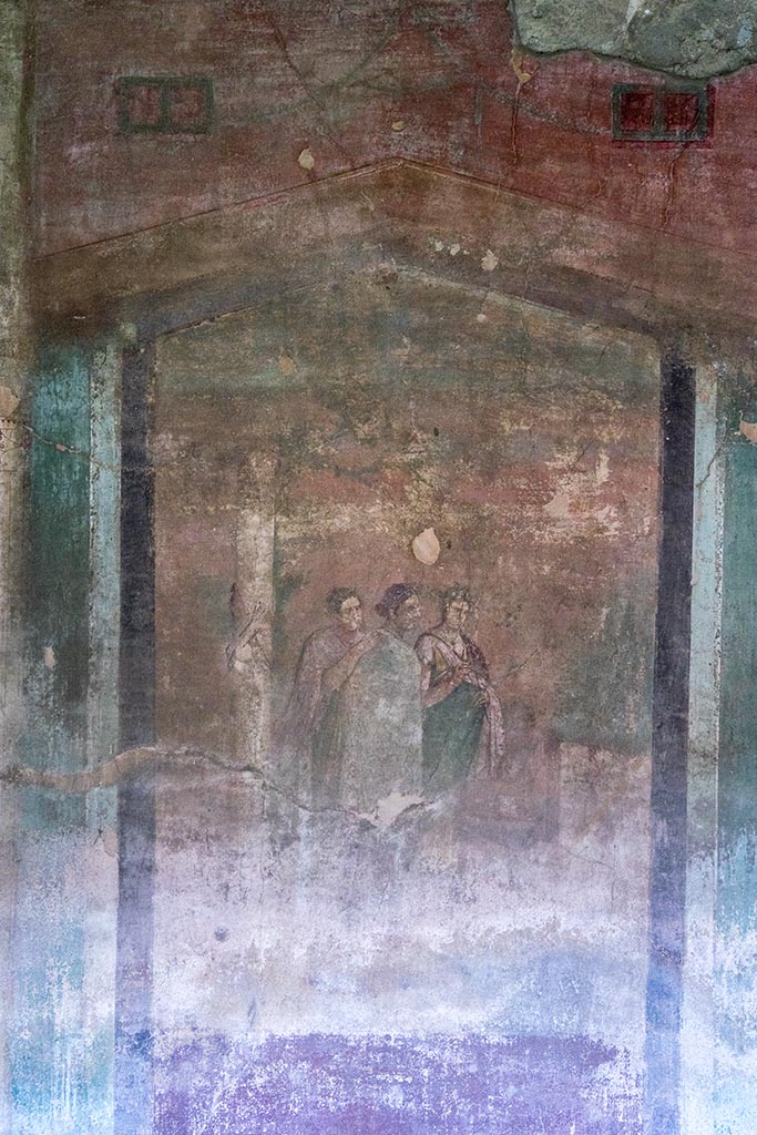 IX.14.4 Pompeii. July 2024. 
Room 3, central painting with three figures on south wall. Photo courtesy of Johannes Eber.