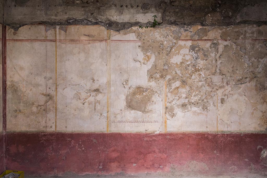 IX.14.4 Pompeii. July 2024. East wall of room F on the east side of the atrium. Photo courtesy of Johannes Eber.