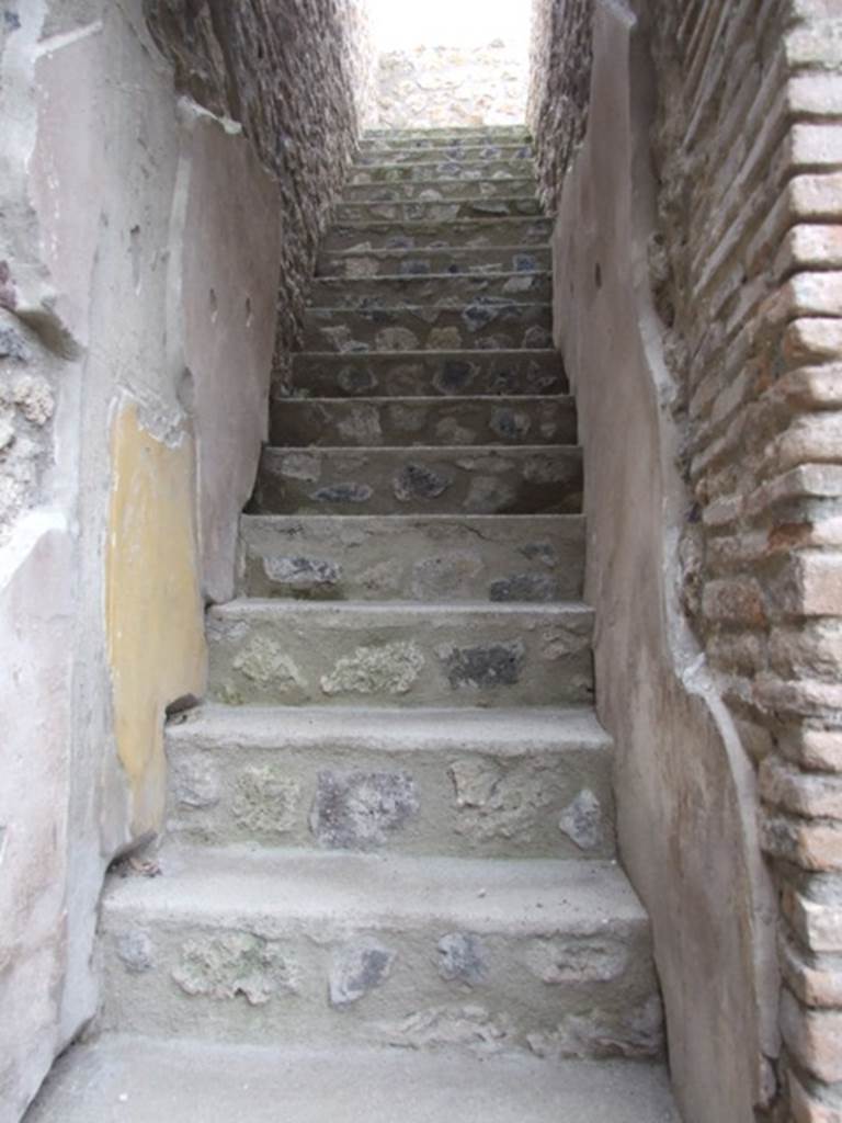 IX.14.4 Pompeii. December 2007. Staircase on south-east side of room 27, the atrium of IX.14.2 leading to upper level.