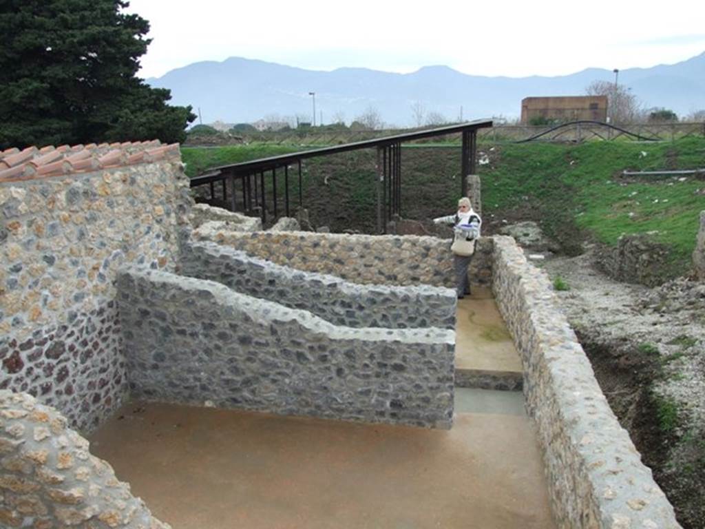 IX.14.4 Pompeii.    December 2007.  
Looking south over restored upper storey towards IX.14.c.
