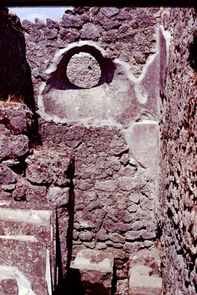 IX.14.4 Pompeii, 1978. Looking east across room 8 towards circular window above latrine. Photo by Stanley A. Jashemski.   
Source: The Wilhelmina and Stanley A. Jashemski archive in the University of Maryland Library, Special Collections (See collection page) and made available under the Creative Commons Attribution-Non Commercial License v.4. See Licence and use details. J78f0222