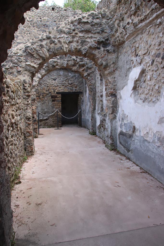 Villa of Diomedes, Pompeii. October 2023. 
Looking east along the south side of the portico, into corridor/rooms. Photo courtesy of Klaus Heese.
(Villa Diomedes Project – area 46, from area 45).
(Fontaine, corridor/rooms 5a, from 5b).