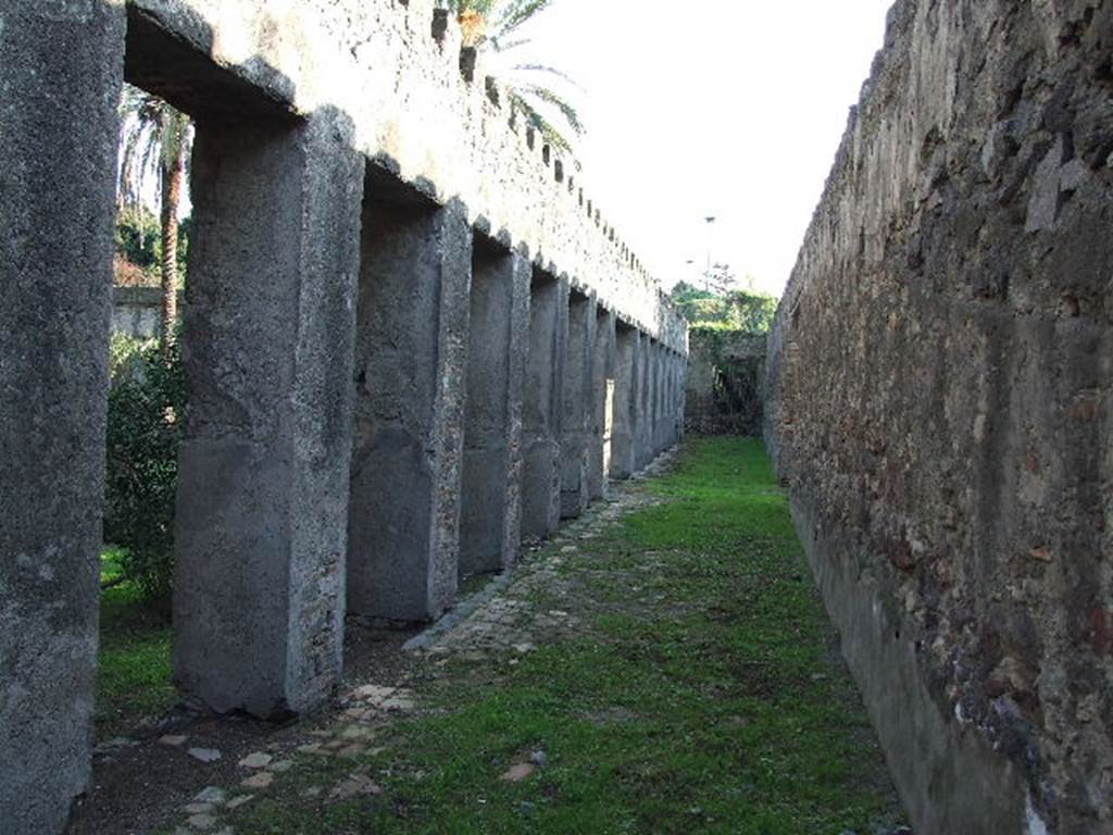 HGW24 Pompeii. December 2006. Looking south along the west portico towards the south-west corner. 
There would have been a turret in both the south-west and north-west corners of the peristyle. 
Both of these turrets would have given a magnificent view of the sea. 
(Fontaine, from near 5,2b, near west wall of garden peristyle).
Nos 9, 10, from the plan by La Vega, would have been found in this level of the west portico.
No.11, from the plan by La Vega, was found just outside the west wall, on the right.
PAH, addendum, p.120 – 121, (See No.9 below, on plan by La Vega).
