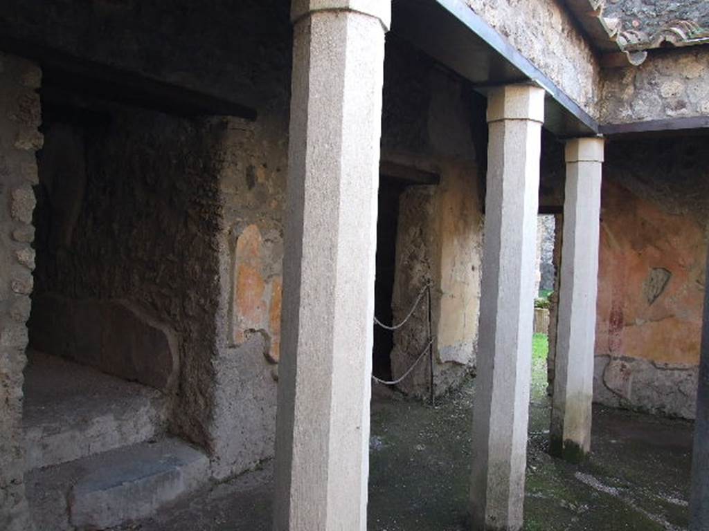 HGW24 Pompeii. December 2006. South-west side of small courtyard in baths complex. According to Mau, on the left is a doorway to the apodyterium, and in the centre is a doorway to a storeroom.
See Mau, A., 1907, translated by Kelsey, F. W., Pompeii: Its Life and Art. New York: Macmillan. (p. 356). According to Breton, the doorway on the left would have led to the frigidarium, and the doorway in the centre would have led to the apodyterium or changing room. See Breton, Ernest. 1870. Pompeia, Guide de visite a Pompei, 3rd ed. Paris, Guerin.