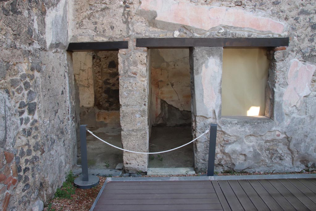 HGW24 Pompeii. Villa of Diomedes. October 2023. 
Two doorways in south-east corner of peristyle, doorway to room 2,14 and 2,15, on left, and into room 2.13, on right.
Photo courtesy of Klaus Heese.
