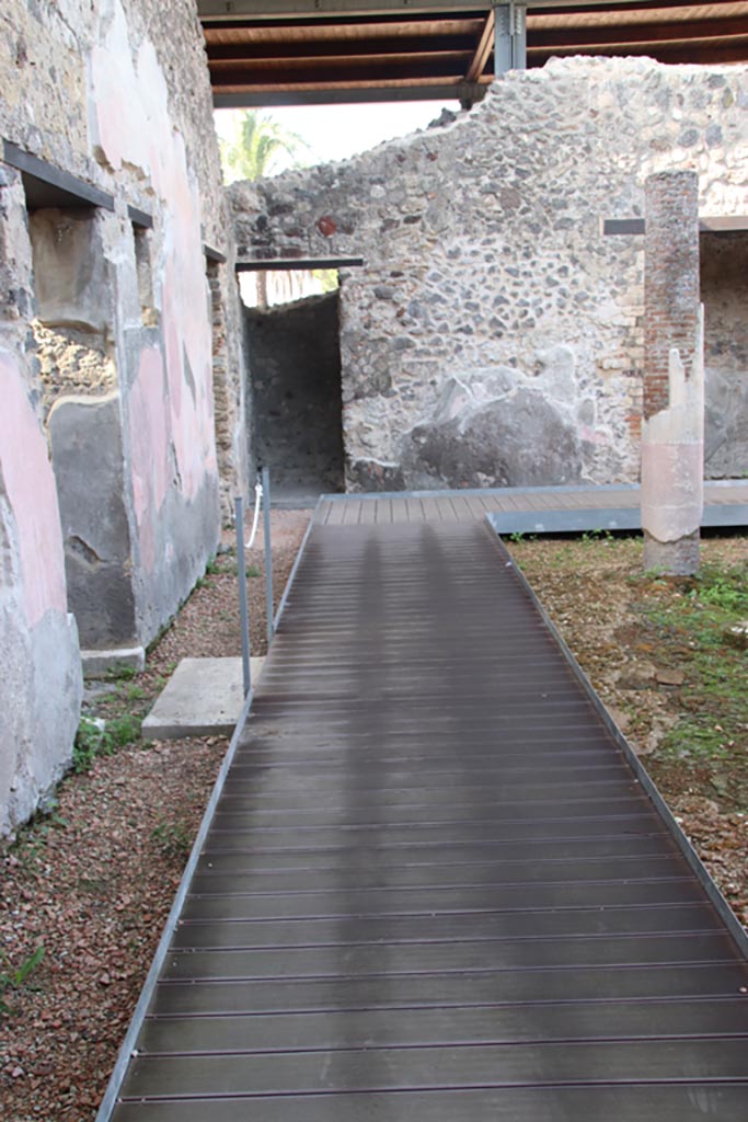 HGW24 Pompeii. Villa of Diomedes. October 2023. 
Looking west along south portico, with doorway into antechamber, on left. Photo courtesy of Klaus Heese.