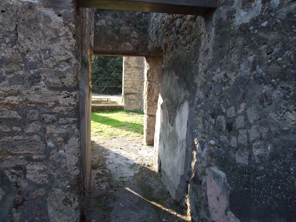 HGW24 Pompeii. December 2006. North side of peristyle, looking west along corridor towards terrace.
On the La Vega plan, no.28 would have been placed in the lower left of the photo. 
(Villa Diomedes Project – area 23).
(Fontaine, room 2,3 (ala) in north-west corner of portico).
No.31 was found at the end of this corridor, approximately at the start of the green grass in the photo.
(Villa Diomedes Project – area 33).
(Fontaine, west end of corridor 2.4, onto terrace).