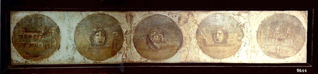 HGW24 Pompeii. Fresco with medallions with theatre masks and seaside villas, cut separately from the walls.
Now in Naples Archaeological Museum. Inventory number 9844.
According to Pagano and Prisciandaro, and to the plan of La Vega, these may have come from either of the areas shown as nos. 2 or 3 on the plan by La Vega. 
(Fontaine room 2.6).